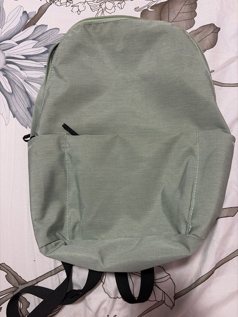 9.9 Sale Light Green Backpack (Category: Backpacks) located in Morong. Submitted by Kaycer00 (Listing ID 1455494515, Image 2). Description: Bought this in Net outlet in Taiwan - Simple light mint green backpack - Front zipper pocket for easy access - Internal divider for organized storage - Comfortable black straps - Ideal for everyday use and school - Lightweight and easy to carry With free beach bag or bundle to black chantria bagpack for only 