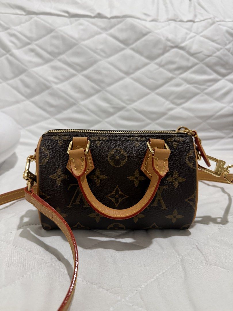 Louis Vuitton monogram mini speedy (dustbag only) (Category: Luxury Bags & Wallets) located in Morong. Submitted by baemuzy (Listing ID 1455499240, Image 2). Description: - Classic Monogram Canvas - Vachetta Leather Trim - Gold Hardware - Used once - Detachable Shoulder Strap Included.