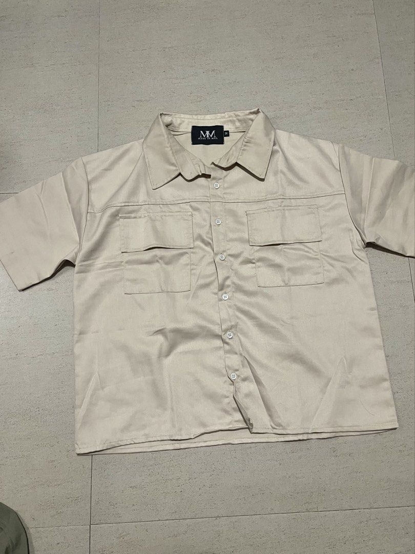 Made in MNL Cropped boxed Polo Khaki (Category: Tshirts & Polo Shirts ) located in Quezon City. Submitted by keishaiana (Listing ID 1455400806, Image 1). Description: MM Cropped Boxy polo Khaki Never Worn No flaws Size is in the pic.