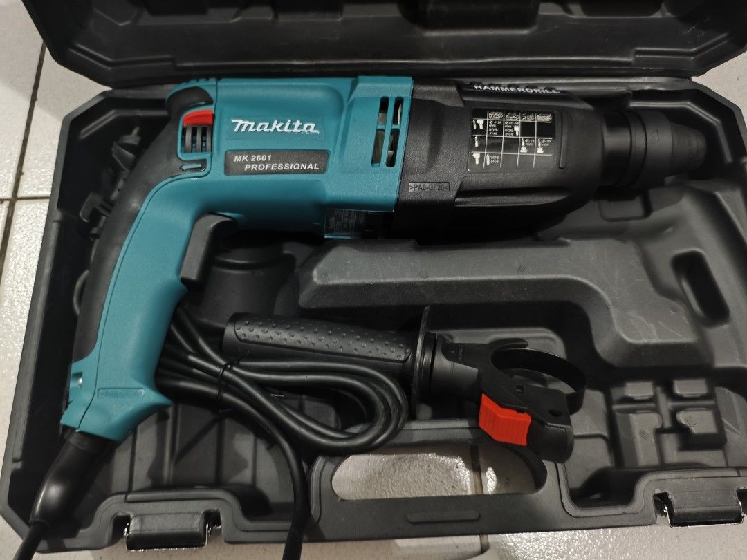 Makita Rotary Hammer Drill/Jackhammer (Category: Construction Tools & Equipment) located in Quezon City. Submitted by mktoolsenterprise (Listing ID 1455437945, Image 2). Description: All items are Brand New ‼️ FB PAGE: ‼️MK TOOLS ENTERPRISE ‼️ 📍Batasan Hills Quezon City📍 - Package Includes: ✅Rotary Hammer ✅Accessorues ✅Drill Bits ✅Manual ✅Hard case ✅Handle - Professional Makita 2601 Rotary Hammer Drill - Complete set with drill bits and chisels