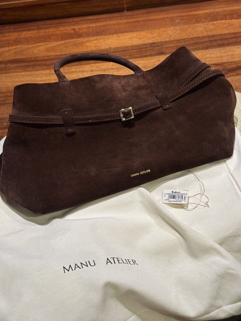 Manu Atelier Le Cambon 35 Deep Brown Suede (Category: Tote Bags) located in Paranaque City. Submitted by msbentables (Listing ID 1455444948, Image 1). Description: RFS decluttering Bought from Rustan’s Used but not abused No stains Le Cambon 35 - a fusion of simplicity and artistry crafted to effortlessly fit into your daily life. Designed with soft calf skin leather, this bag blends sophistication with practicality, accommodating a 13-inch MacBo
