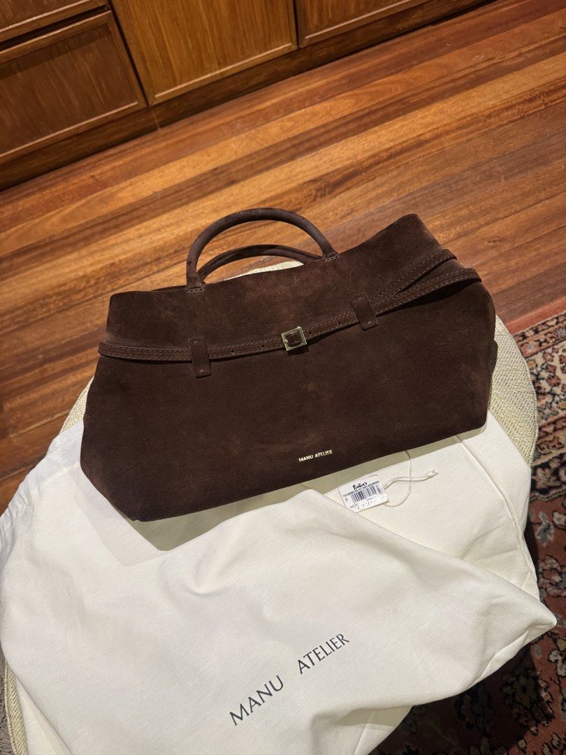 Manu Atelier Le Cambon 35 Deep Brown Suede (Category: Tote Bags) located in Paranaque City. Submitted by msbentables (Listing ID 1455444948, Image 3). Description: RFS decluttering Bought from Rustan’s Used but not abused No stains Le Cambon 35 - a fusion of simplicity and artistry crafted to effortlessly fit into your daily life. Designed with soft calf skin leather, this bag blends sophistication with practicality, accommodating a 13-inch MacBo