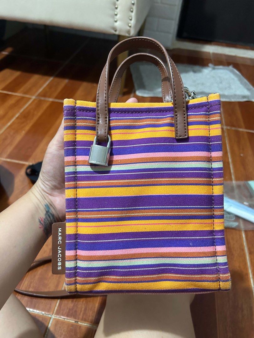 Marc Jacobs Mini Tote Bag Striped (Category: Luxury Bags & Wallets) located in Caloocan City. Submitted by jill262626 (Listing ID 1455331774, Image 1). Description: - Cute mini tote bag from Marc Jacobs - Features colorful stripes all over - Adorable small lock detail on the handle - Genuine leather handles and trim - Perfect size for carrying essentials and quick outings - authentic .