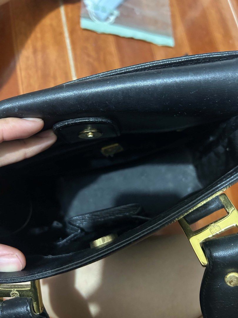 MCM Black Leather Tote Bag (Category: Luxury Bags & Wallets) located in Caloocan City. Submitted by jill262626 (Listing ID 1455387744, Image 3). Description: - Classic black MCM tote bag - Genuine leather material - Elegant gold hardware - Multiple interior compartments for organization - Comfortable top handles for carrying - A timeless and versatile piece for everyday style - authentic .