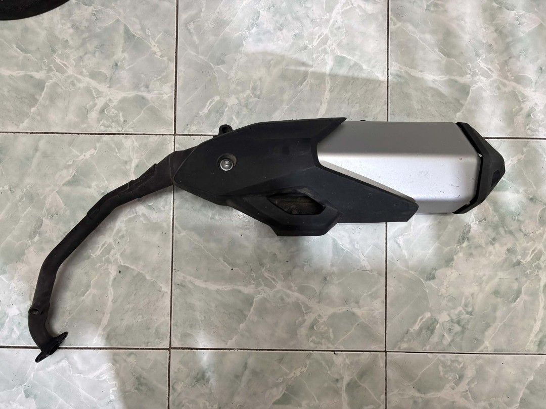 Motorcycle Exhaust Pipe Muffler Silencer (Category: Body Parts and Accessories) located in Manila. Submitted by byguurl (Listing ID 1455341586, Image 1). Description: Honda ADV 160 Stock Muffler/Exhaust • Only used up to 1 km ODO • Removed almost immediately after purchase to upgrade to an aftermarket exhaust • Not fully used; still in excellent condition • Complete and ready to install (Negotiable for sure buyer) 📩 Message me for more photos, d