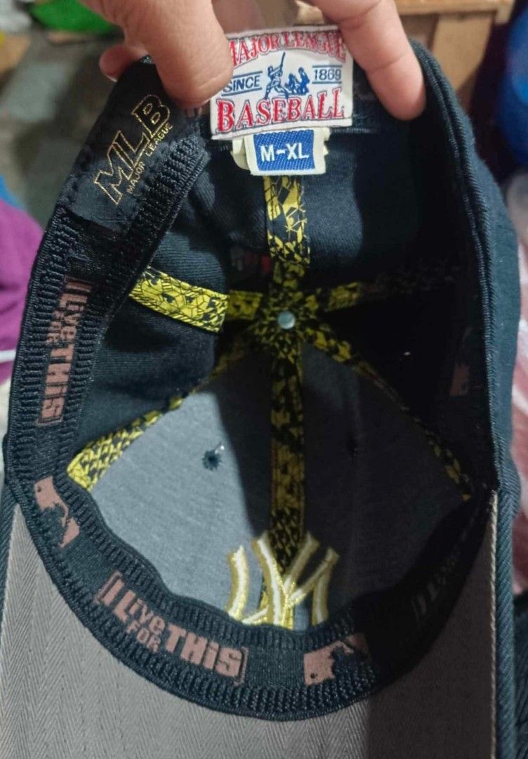 New York Yankees MLB Baseball Cap (Category: Caps & Hats) located in Caloocan City. Submitted by rtarellano (Listing ID 1455390750, Image 2). Description: - Black New York Yankees Cap - Gold NY logo on front - MLB logo on side - Size: M-XL - Shows some wear on brim and inside - Great for any Yankees fan.