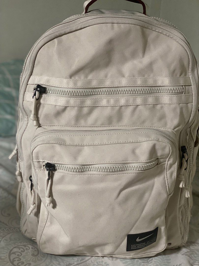 Nike Utility Power Backpack ‘Beige’ Mens (Category: Backpacks) located in Caloocan City. Submitted by percyy.k (Listing ID 1455347365, Image 2). Description: - Nike Utility Power Backpack - Color: Beige - Ideal for everyday use or travel - Multiple pockets for excellent organization - Authentic, Made with durable material - Minor signs of usage, everything disclosed in the photos -Only issue is that circle thing at the bottom right side which is 