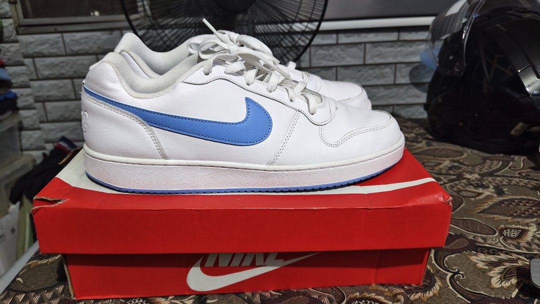 Nike Ebernon Low White and Blue Sneakers (Category: Sneakers) located in Manila. Submitted by ervinj23 (Listing ID 1455425719, Image 3). Description: - Classic white Nike sneakers - Features blue accents - Lace-up closure - Comes with original Nike box - Ideal for casual wear or sports.