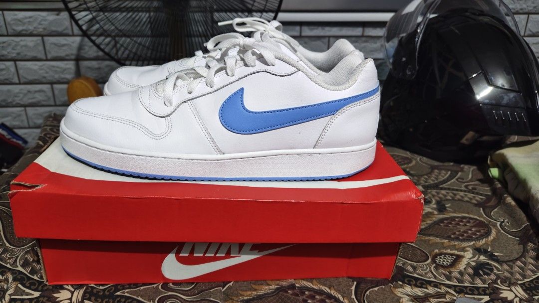 Nike Ebernon Low White and Blue Sneakers (Category: Sneakers) located in Manila. Submitted by ervinj23 (Listing ID 1455425719, Image 2). Description: - Classic white Nike sneakers - Features blue accents - Lace-up closure - Comes with original Nike box - Ideal for casual wear or sports.
