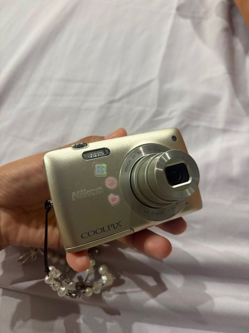 Nikon Coolpix S4300 Digital Camera (Category: Cameras) located in San Pedro. Submitted by jowiosabel (Listing ID 1455328696, Image 1). Description: Nikon Coolpix S4300 digital camera - Good condition (All working) - Compact point-and-shoot style - Touchscreen - Comes with a cute beaded wrist strap - Includes a small pouch - Battery charger included - Minor vignette on screen but does not affect the quality - Ideal for everyday, casual photography