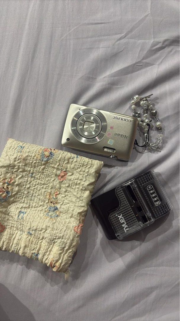 Nikon Coolpix S4300 Digital Camera (Category: Cameras) located in San Pedro. Submitted by jowiosabel (Listing ID 1455328696, Image 3). Description: Nikon Coolpix S4300 digital camera - Good condition (All working) - Compact point-and-shoot style - Touchscreen - Comes with a cute beaded wrist strap - Includes a small pouch - Battery charger included - Minor vignette on screen but does not affect the quality - Ideal for everyday, casual photography