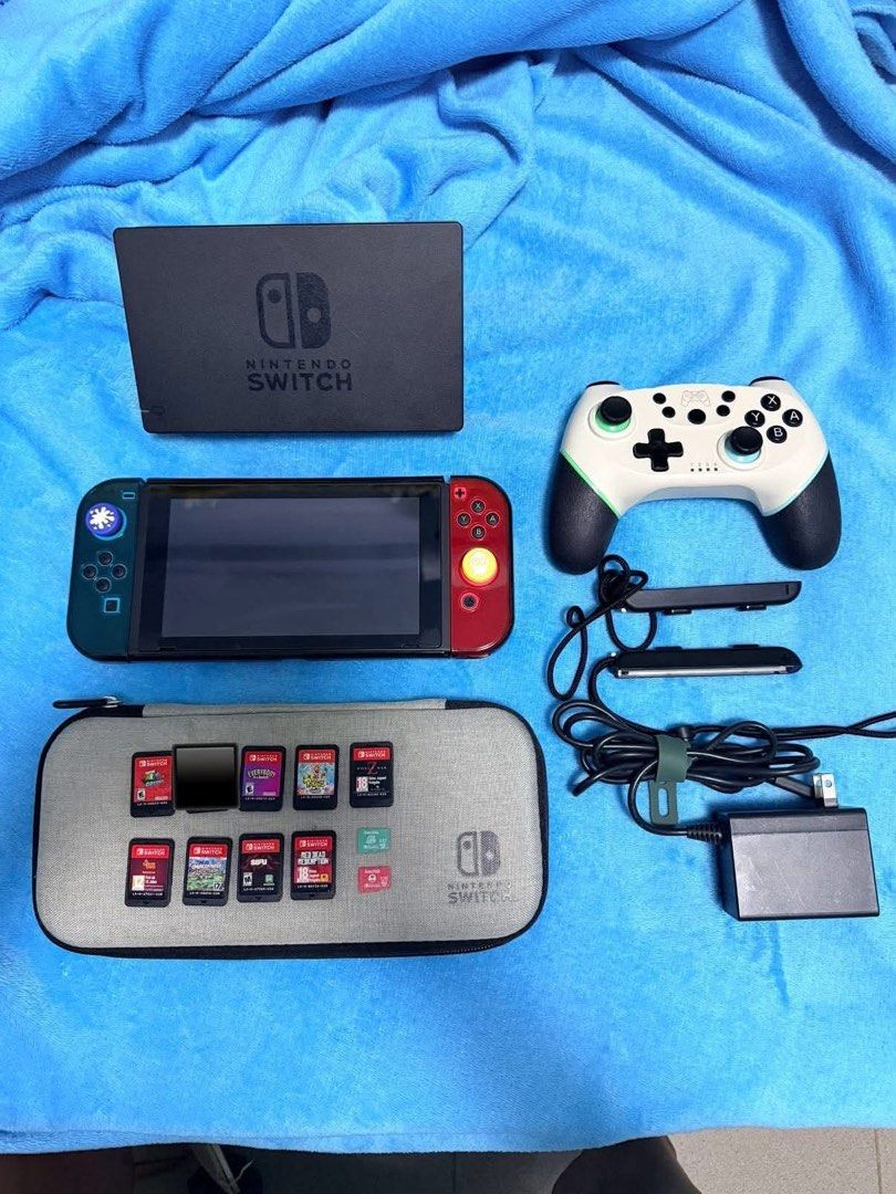 Nintendo Switch Console with Games and Accessories (Category: Nintendo) located in Pasig City. Submitted by wisefish_418f1d (Listing ID 1455341589, Image 1). Description: Nintendo Switch V2 (BUNDLE) inclusion: orig charger Dock Protective case Protective pouch wireless controller Sandisk memory 512gb & 128gb Games: World War Z Rabbids Party Everybody switch Sifu Red Redemption Overcooked It takes two Mario Odyssey And other Digital Games Price 21