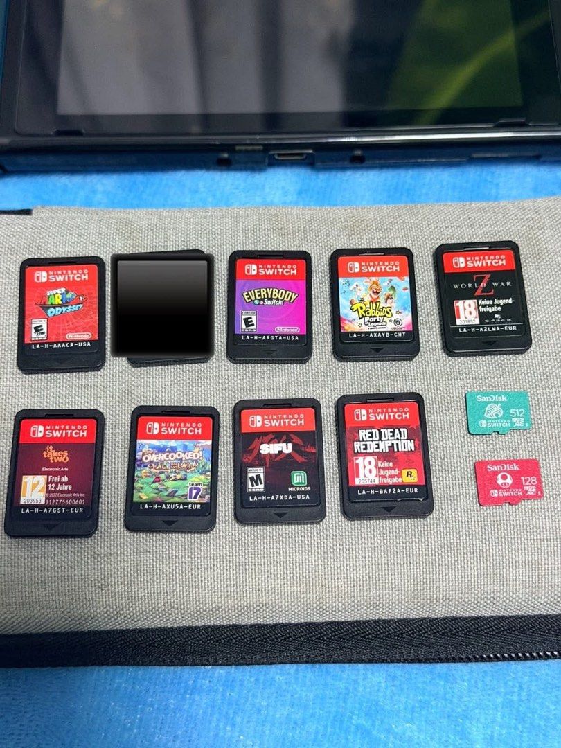 Nintendo Switch Console with Games and Accessories (Category: Nintendo) located in Pasig City. Submitted by wisefish_418f1d (Listing ID 1455341589, Image 2). Description: Nintendo Switch V2 (BUNDLE) inclusion: orig charger Dock Protective case Protective pouch wireless controller Sandisk memory 512gb & 128gb Games: World War Z Rabbids Party Everybody switch Sifu Red Redemption Overcooked It takes two Mario Odyssey And other Digital Games Price 21
