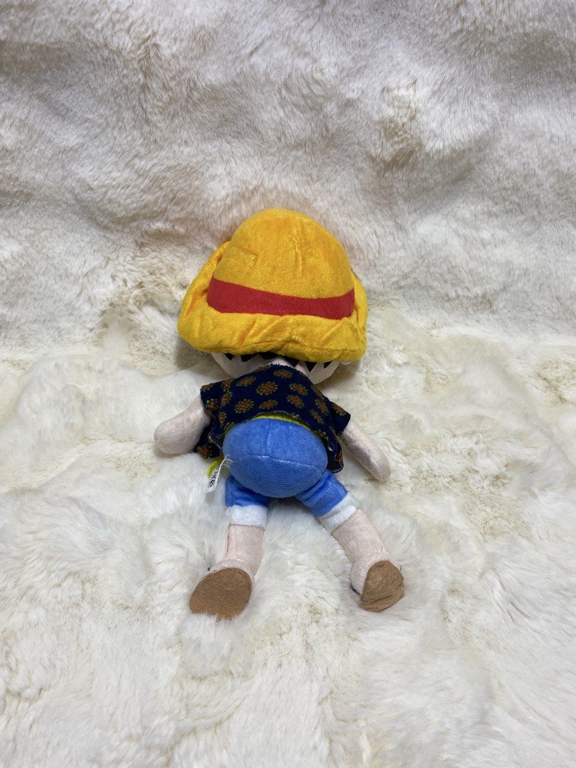 One Piece Monkey D. Luffy Plush Toy (Category: Plushies & Soft Toys) located in Kalibo. Submitted by ollie_stuffshop (Listing ID 1455492544, Image 3). Description: 24cm x 12cm Before you send your inquiries: ❗️Last Price is already posted ❗️Manage your expectations, WYSIWYG ❗️May need washing ❗️Shipping day is every Sunday - Cute Monkey D. Luffy plush toy from the anime One Piece. - Features his signature straw hat, blue shorts, and patterned shi