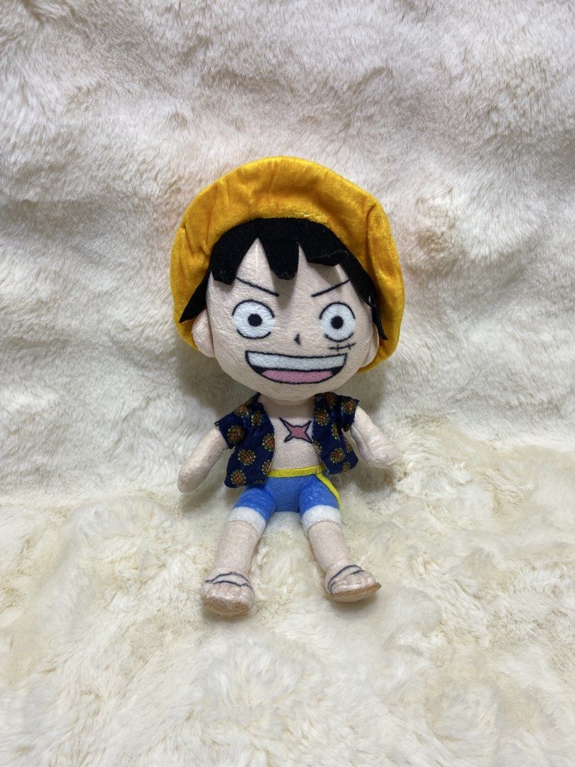 One Piece Monkey D. Luffy Plush Toy (Category: Plushies & Soft Toys) located in Kalibo. Submitted by ollie_stuffshop (Listing ID 1455492544, Image 1). Description: 24cm x 12cm Before you send your inquiries: ❗️Last Price is already posted ❗️Manage your expectations, WYSIWYG ❗️May need washing ❗️Shipping day is every Sunday - Cute Monkey D. Luffy plush toy from the anime One Piece. - Features his signature straw hat, blue shorts, and patterned shi