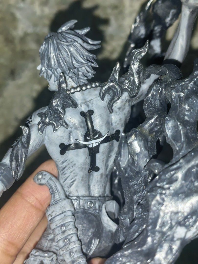 One Piece Portgas D. Ace Figure - Dynamic Pose (Category: Figurines & Statues) located in Paranaque City. Submitted by furugiyafinds (Listing ID 1455421114, Image 3). Description: - Portgas D. Ace figure from One Piece - Dynamic pose with realistic flame effects - Highly detailed sculpt featuring his signature tattoos and scar - Approximately 6-7 inches tall - Must-have display piece for any One Piece fan's collection.