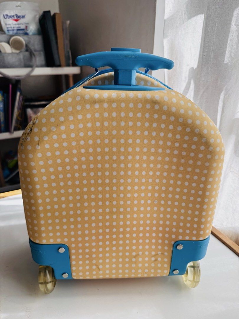 OOPS! Doggy Rolling Luggage Suitcase for Kids (Category: Luggage) located in Cainta. Submitted by casaesguerra (Listing ID 1455392926, Image 3). Description: - Adorable doggy rolling luggage for kids - Bright orange and yellow polka dot design - Perfect size for travel and sleepovers - Retractable handle and wheels for easy transport - Interior straps to keep belongings secure - Encourages kids to pack their own items - Minor scuffs on exterior f