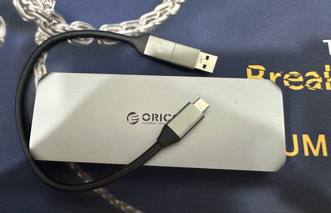 ORICO USB4 M.2 NVME SSD Enclosure (Category: Computer Parts) located in Manila. Submitted by hsahdin (Listing ID 1455404903, Image 1). Description: - ORICO USB4 M.2 NVMe SSD Enclosure - Supports up to 8TB capacity - Compatible with Thunderbolt 3/4 - High-speed data transfer up to 40 Gbps - Integrated cooling fan for optimal performance - Tool-free installation for easy setup Used with care. 100% functional. SSD in photo is for reference only..