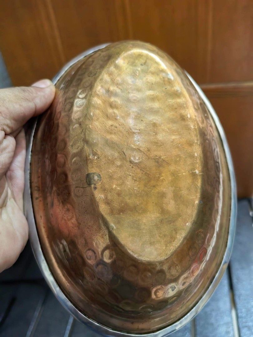 Oval Copper Pan or Gratin Dish (Category: Other Kitchenware & Tableware) located in Cebu City. Submitted by dudes_villanueva (Listing ID 1455368454, Image 2). Description: Oval Copper Pan or Gratin Dish 📌 Features an aged patina and a contrasting metal rim. 📌 Material: Solid hammered copper body with visible texturing from manual fabrication and a lighter rim/lining. 📌 Design: Classic oval shape traditionally used for kitchen prep, serving, or
