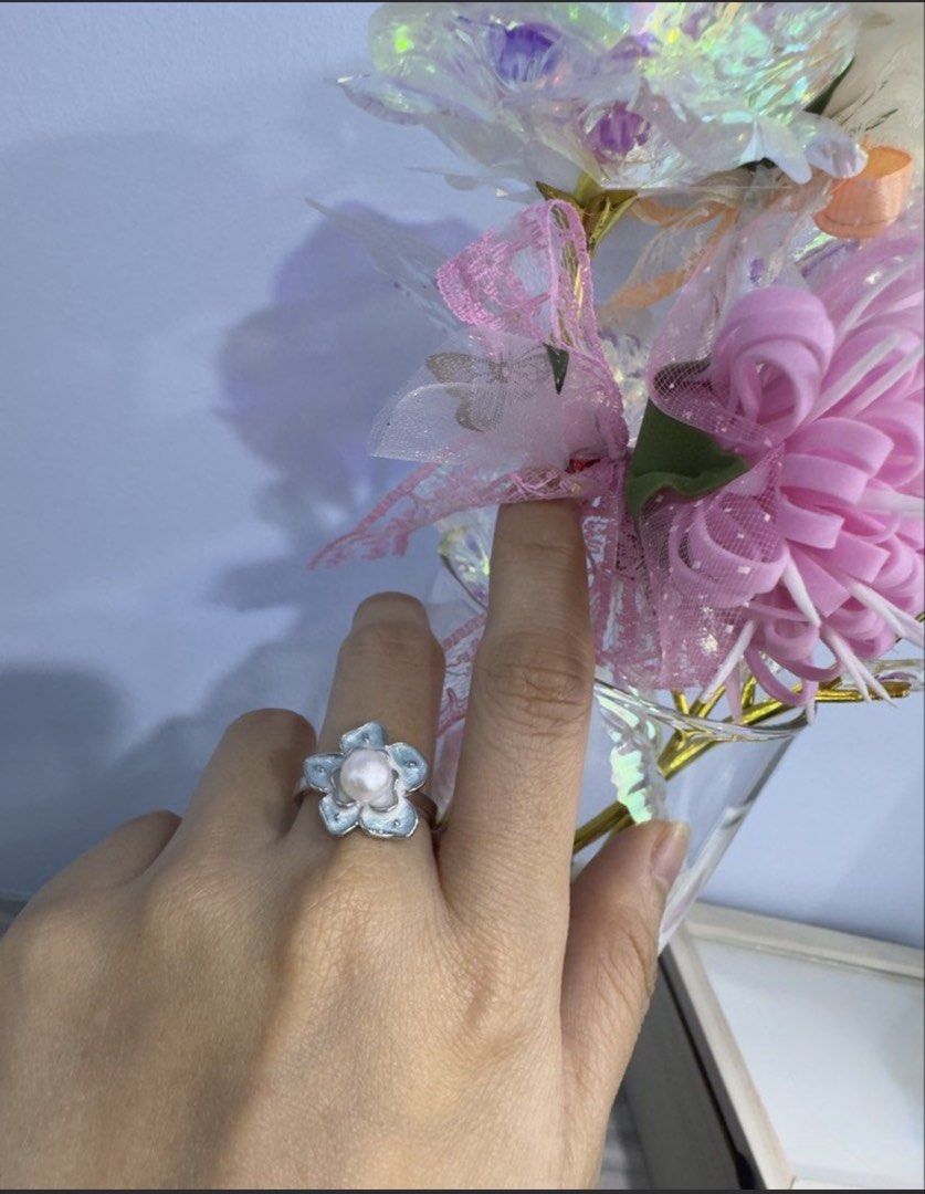 Pearl Ring (Category: Rings) located in Singapore. Submitted by tangping_99-6 (Listing ID 1455396921, Image 2). Description: - Adjustable pearl rings - S$10 each for 1st row ; S$15 for red flower (sold) - Made from natural freshwater pearl - Perfect for adding a subtle, elegant touch to any outfit.
