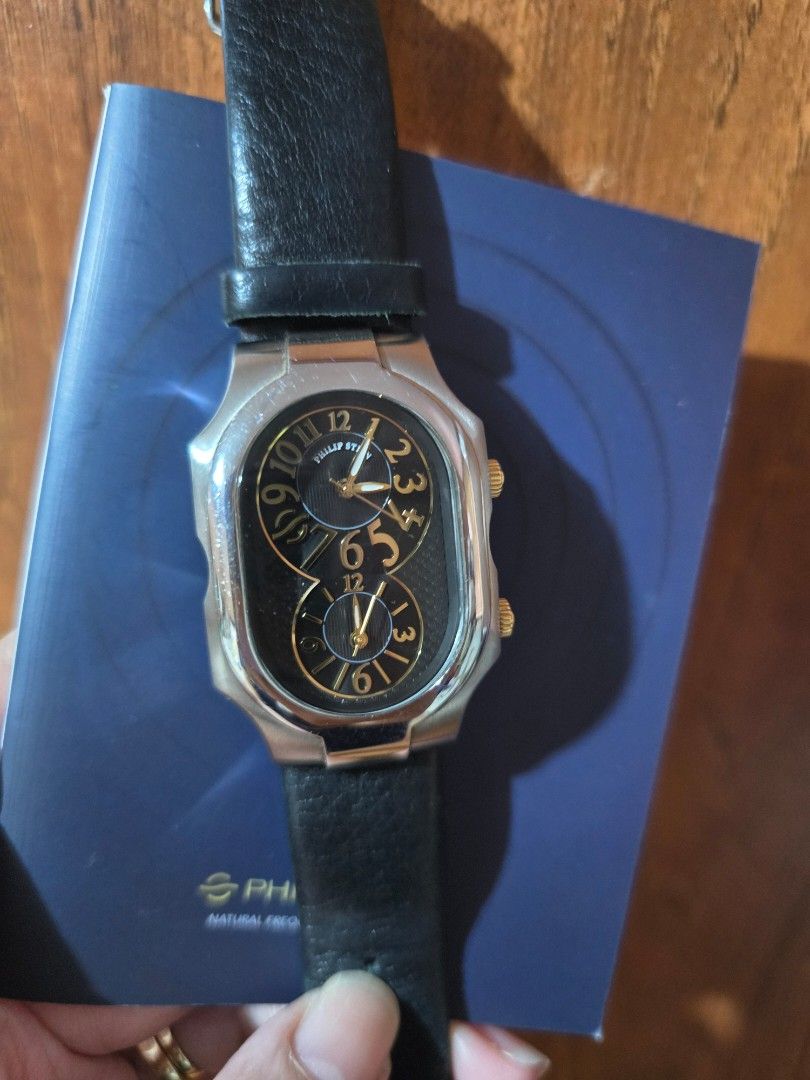 Philip Stein Dual Time Watch with Extra Strap (Category: Women's Watches) located in Las Pinas. Submitted by luxeprelovedstuff (Listing ID 1455387287, Image 3). Description: - Authentic Philip Stein Dual Time Watch - Elegant black dial with gold accents - Water Resistant 3 ATM - Features Natural Frequency Technology - Comes with original box and tan wallet - Includes an extra white strap - Serial Number: 2TF174303.