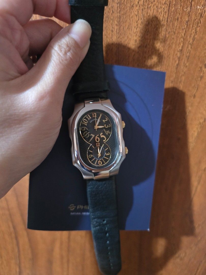 Philip Stein Dual Time Watch with Extra Strap (Category: Women's Watches) located in Las Pinas. Submitted by luxeprelovedstuff (Listing ID 1455387287, Image 2). Description: - Authentic Philip Stein Dual Time Watch - Elegant black dial with gold accents - Water Resistant 3 ATM - Features Natural Frequency Technology - Comes with original box and tan wallet - Includes an extra white strap - Serial Number: 2TF174303.