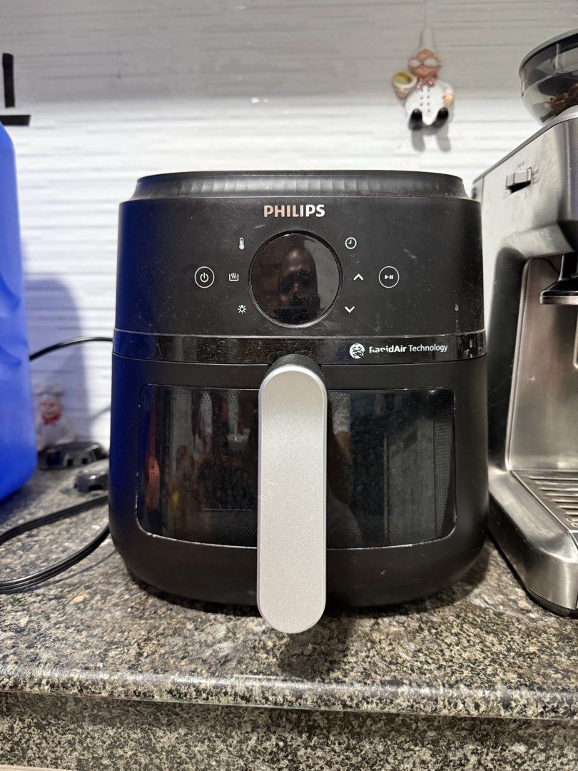 Philips Air Fryer Rapid Air Technology (Category: Fryers) located in Cavite. Submitted by berniemedina (Listing ID 1455374780, Image 1). Description: - Philips Air Fryer with Rapid Air Technology - Sleek black exterior with silver handle - Easy-to-use digital display - Removable basket for hassle-free cleaning - Perfect for healthier cooking - In excellent working condition.