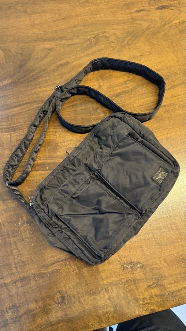 Porter Yoshida & Co. Black Nylon Messenger Bag (Category: Sling Bags) located in San Fernando. Submitted by enzorod (Listing ID 1455368406, Image 1). Description: - Classic black messenger bag by Porter Yoshida & Co. - Made from durable nylon material. - Features multiple front pockets for easy access. - Adjustable strap for comfortable carrying. - Smooth and fully functional zippers. - Spacious interior, ideal for daily essentials or travel item
