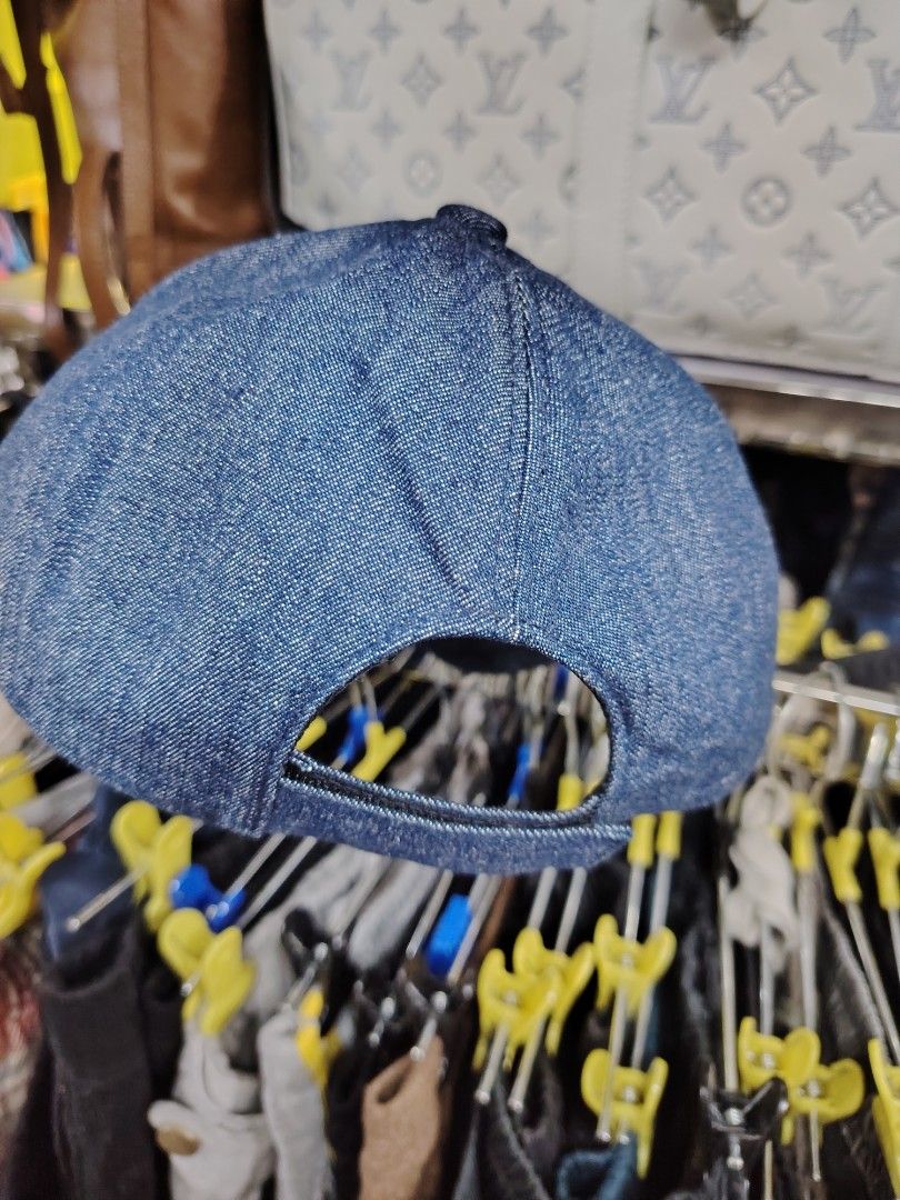 Prada Denim Baseball Cap (Category: Caps & Hats) located in Baguio. Submitted by XycerlynCLXN (Listing ID 1455323285, Image 2). Description: - Prada denim cap - Features the iconic Prada triangle logo on the front - Size: Medium (M) - Made in Italy - Ideal for everyday wear and adding a touch of luxury to your casual outfits.