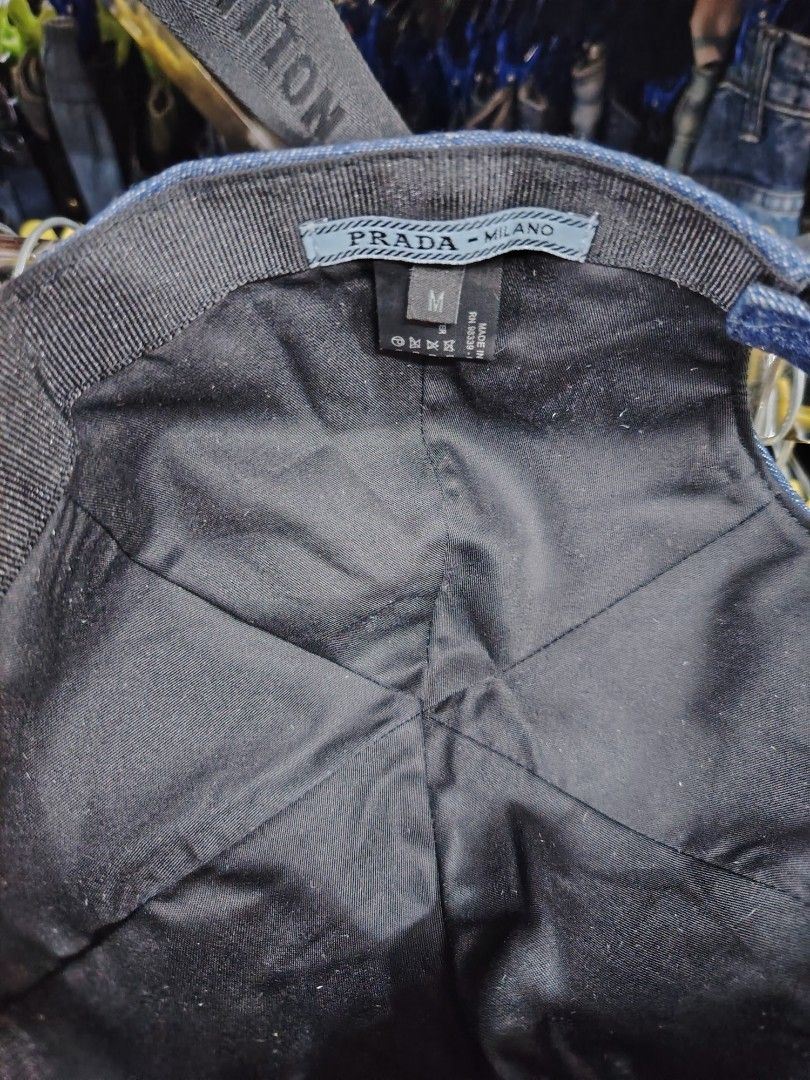 Prada Denim Baseball Cap (Category: Caps & Hats) located in Baguio. Submitted by XycerlynCLXN (Listing ID 1455323285, Image 3). Description: - Prada denim cap - Features the iconic Prada triangle logo on the front - Size: Medium (M) - Made in Italy - Ideal for everyday wear and adding a touch of luxury to your casual outfits.