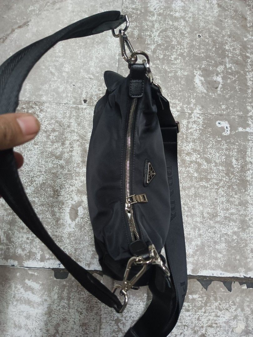Prada Explore Re nylon bag (Category: Luxury Bags & Wallets) located in Baguio. Submitted by brandeditems16 (Listing ID 1455496048, Image 3). Description: - Authentic black Prada nylon shoulder bag - Versatile: can be carried by the top handle or with the detachable crossbody strap - Secure zip closure - Interior features a stylish patterned lining - Elegant silver hardware details - Ideal for everyday use and errands.