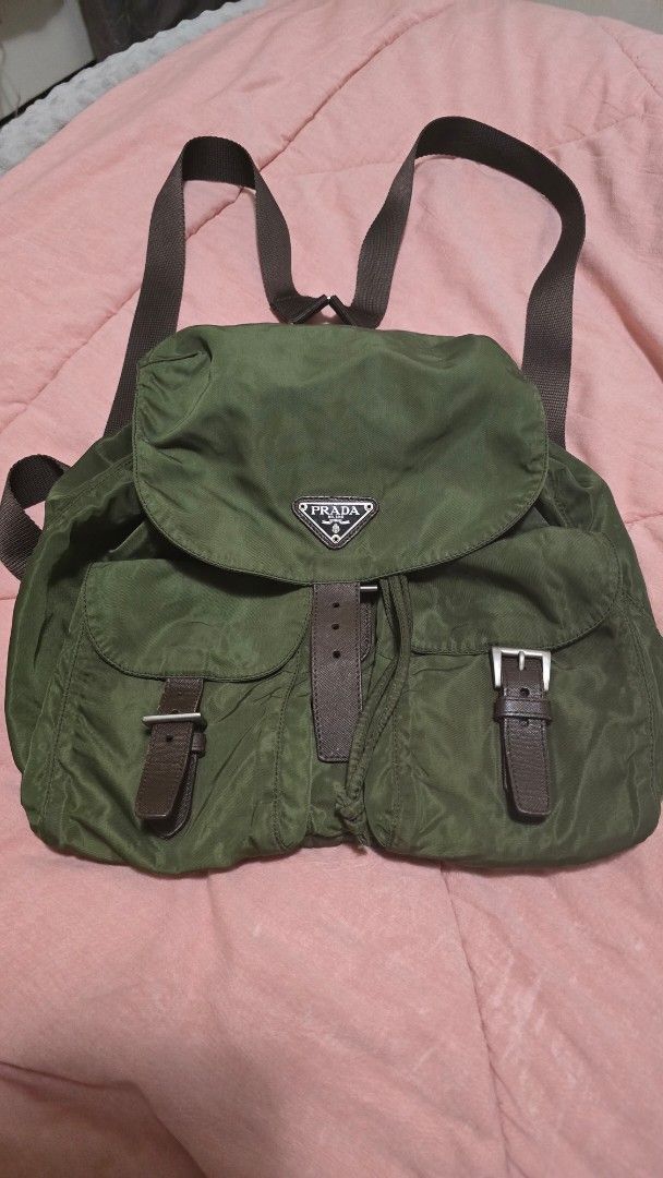 Prada Nylon Backpack Green Leather Accents (Category: Luxury Bags & Wallets) located in Las Pinas. Submitted by insouciant_worrier (Listing ID 1455468340, Image 1). Description: - Authentic Prada Backpack - Color: Olive Green Nylon TAKE NOTE: - Bought online from an authentic luxury reseller on FB - No inclusions.