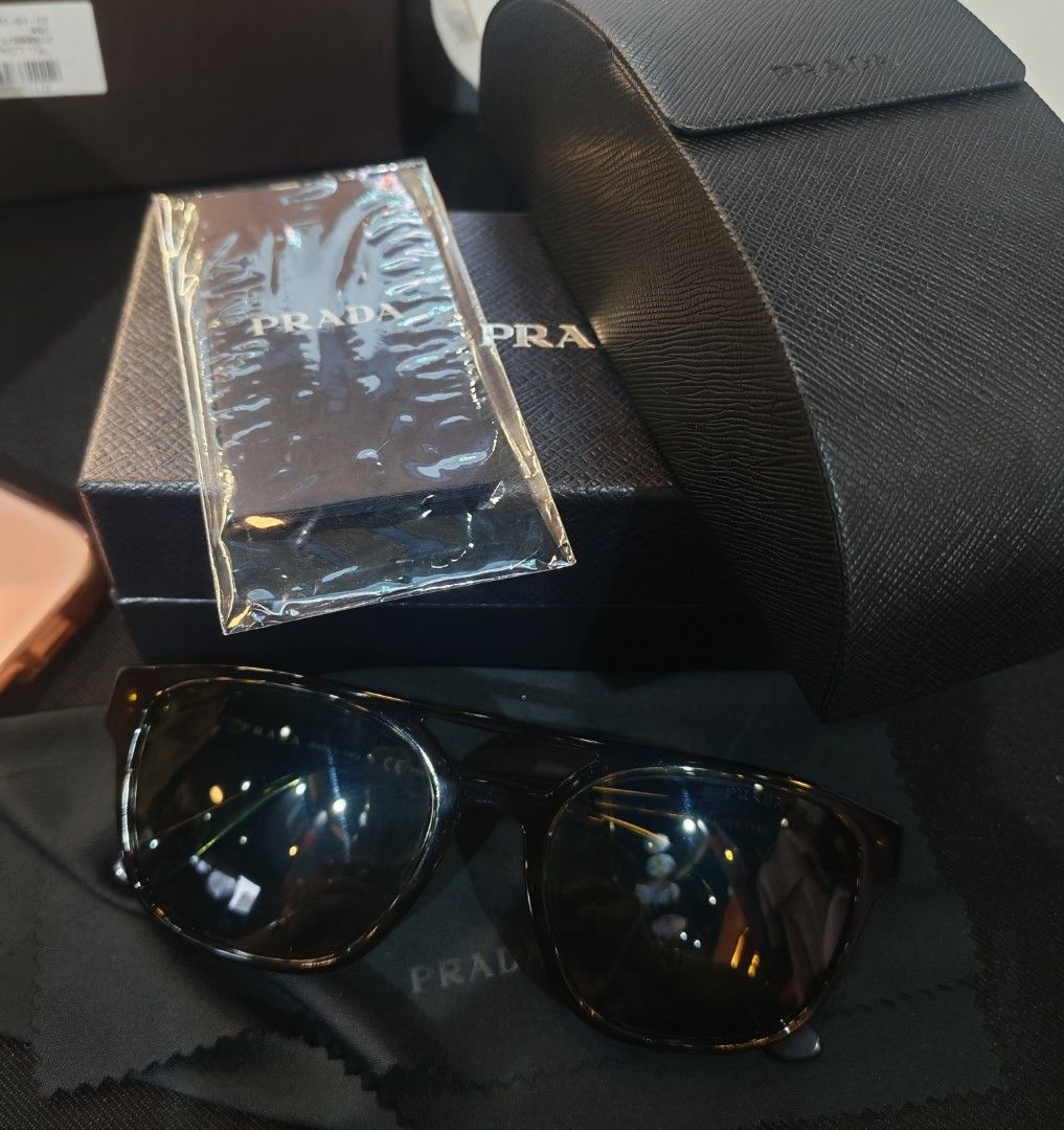 Prada Sunglasses Tortoiseshell Polarized (Category: Luxury Accessories) located in Caloocan City. Submitted by mommyella22 (Listing ID 1455471474, Image 2). Description: - Authentic Prada Sunglasses - Classic Tortoiseshell Pattern - Polarized Lenses for glare reduction - Comes with Original Prada Case - Ideal for sunny days.