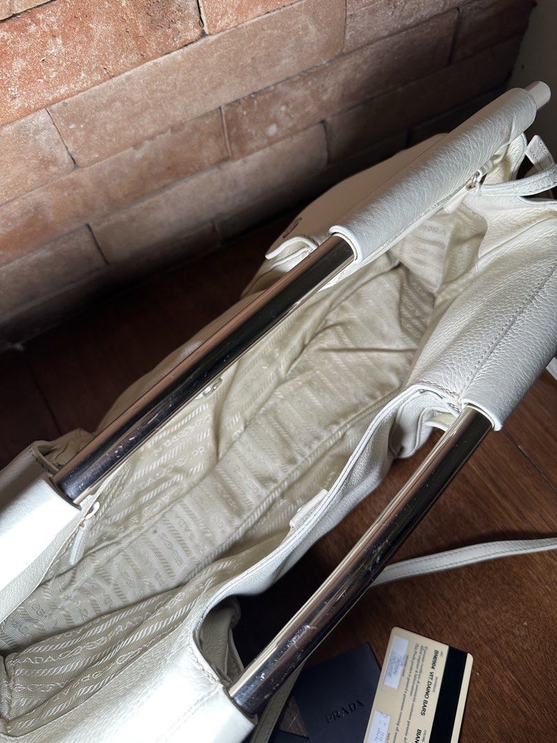 Prada Swing Vitello Daino Messenger SS 2003 (Category: Luxury Bags & Wallets) located in San Fernando. Submitted by diorboi_ (Listing ID 1455423239, Image 2). Description: One of One ARCHIVAL! Prada Swing Bar Vitello Daino Messenger Bag! - comes with auth care & cards - with strap - with og dustbag - super clean! Looks brand new to me - no stains on leather - no rust on bars 🔖 ₱150,000 - this is archival! If yk,yk!.