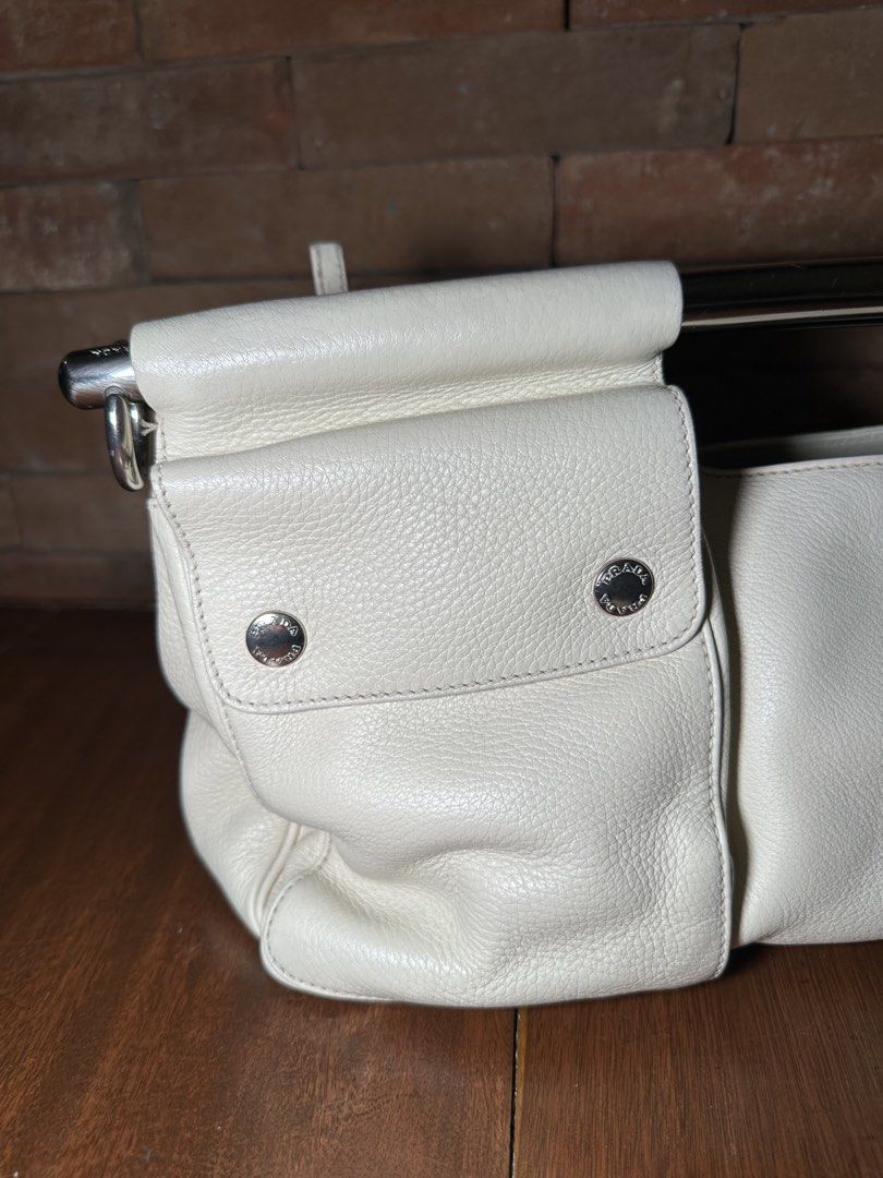 Prada Swing Vitello Daino Messenger SS 2003 (Category: Luxury Bags & Wallets) located in San Fernando. Submitted by diorboi_ (Listing ID 1455423239, Image 3). Description: One of One ARCHIVAL! Prada Swing Bar Vitello Daino Messenger Bag! - comes with auth care & cards - with strap - with og dustbag - super clean! Looks brand new to me - no stains on leather - no rust on bars 🔖 ₱150,000 - this is archival! If yk,yk!.