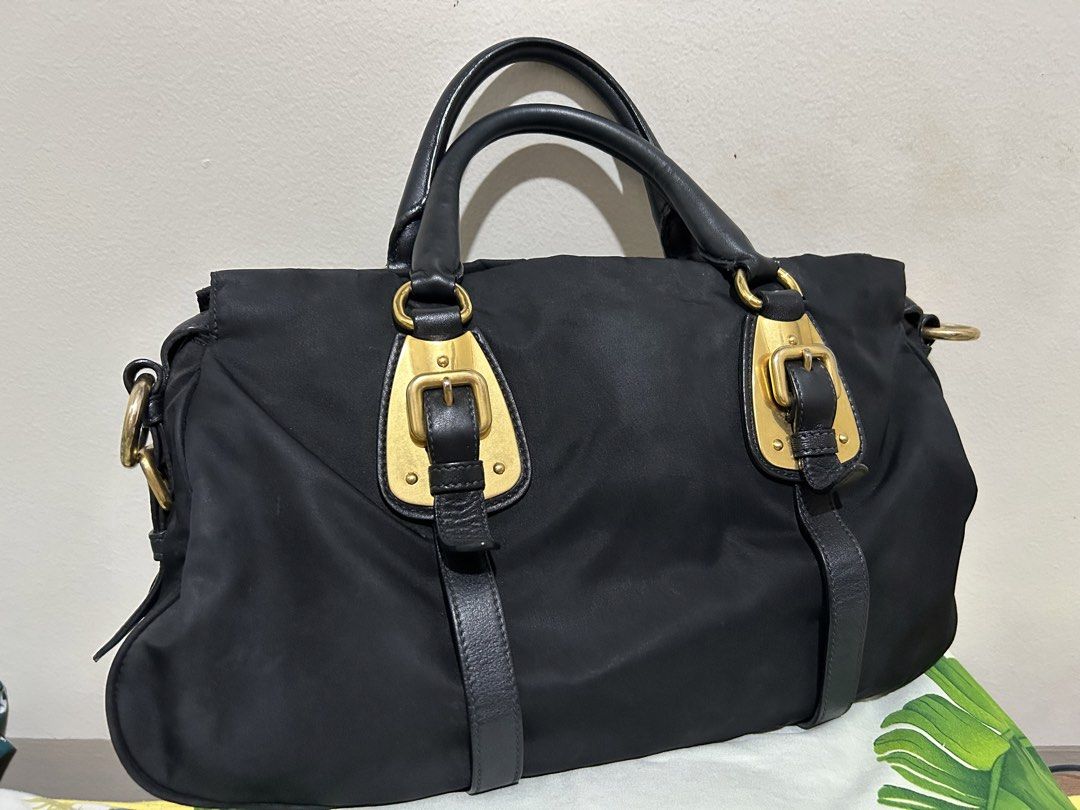 PRADA TESSUTO NYLON (Category: Luxury Bags & Wallets) located in Quezon City. Submitted by dropshopselections (Listing ID 1455343119, Image 3). Description: original with legit grails cert with original strap light tarnishing on the ghw approx 13 x 7.5 x 4.5 inches.