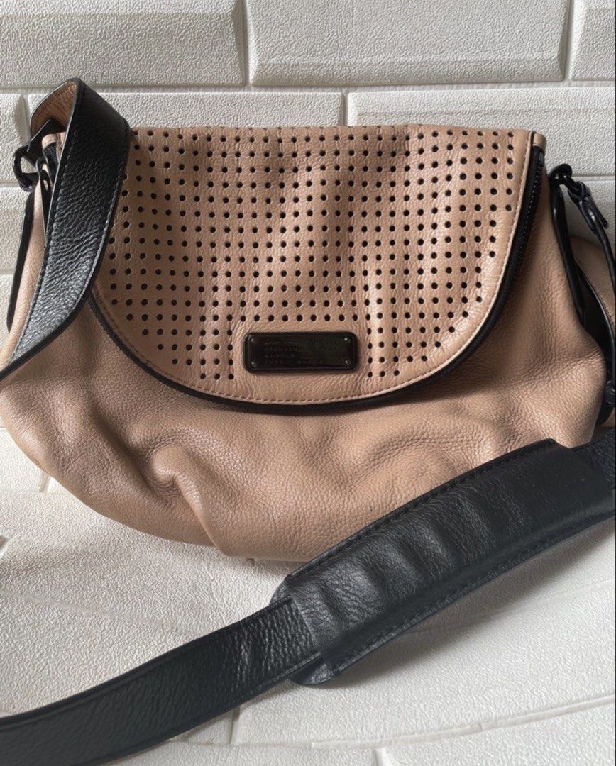Rare Marc Jacobs Perforated Leather Crossbody Bag (Category: Luxury Bags & Wallets) located in Cebu City. Submitted by lucypim (Listing ID 1455441699, Image 1). Description: - Rare Marc Jacobs crossbody bag - Authentic -Genuine leather material - Medium size, lightweight, and spacious - Unique and hard-to-find item.