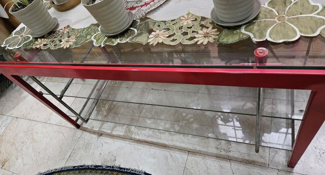 Red Metal Frame Glass Top Console Table with Shelves (Category: Tables & Sets) located in Las Pinas. Submitted by elynanne24 (Listing ID 1455416852, Image 2). Description: Center table for sale for only P3500.00 Tempered glass top Tempered glass shelves Metal and wooden frame For pick-up only If for shipping, vuyer will pay for the fee Location: Village near Las Piñas Doctors Hospital Thank you and God bless. .