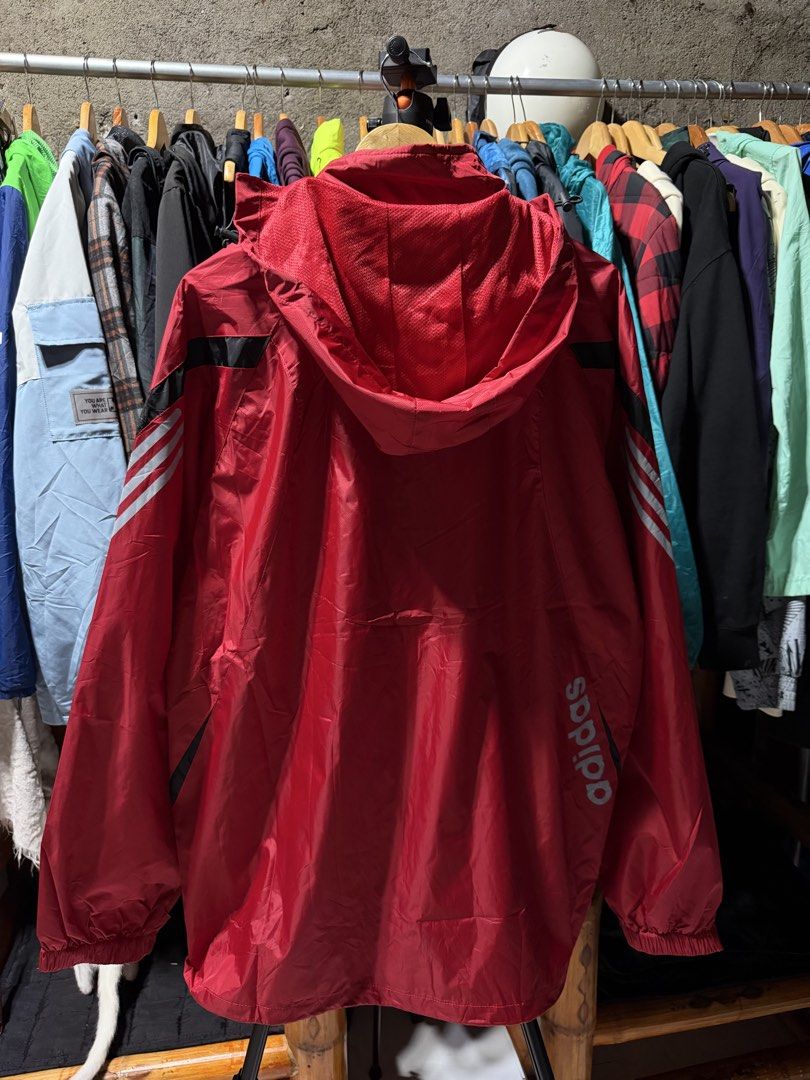 Red Waterproof Jacket with Black Accents (Category: Coats, Jackets and Outerwear) located in Bulacan. Submitted by eman02 (Listing ID 1455344210, Image 2). Description: - Red jacket with a stylish textured finish. - Waterproof material, ideal for rainy days and outdoor activities. - Convenient zippered pocket on the sleeve with a black accent strip. - Lightweight and packable for easy transport and storage..