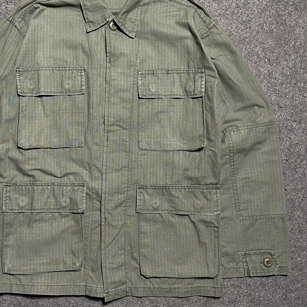 Rotcho D.B.U US Army M-65 Field Jacket (Category: Coats, Jackets and Outerwear) located in Zamboanga. Submitted by rag_20 (Listing ID 1455490052, Image 3). Description: Rotcho D.B.U US Army M-65 Field Jacket A Premium US Army Battle Dress Uniform (BDU) Jacket Shirt. It is made from a durable, lightweight cotton ripstop fabric and features a solid olive drab green colorway (often designated as OG-107). Constructed with signature crosshatch ripstop