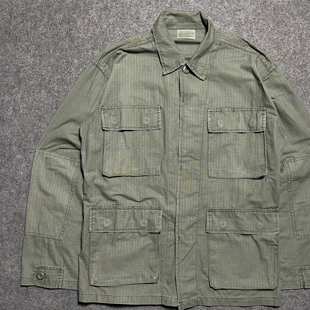 Rotcho D.B.U US Army M-65 Field Jacket (Category: Coats, Jackets and Outerwear) located in Zamboanga. Submitted by rag_20 (Listing ID 1455490052, Image 2). Description: Rotcho D.B.U US Army M-65 Field Jacket A Premium US Army Battle Dress Uniform (BDU) Jacket Shirt. It is made from a durable, lightweight cotton ripstop fabric and features a solid olive drab green colorway (often designated as OG-107). Constructed with signature crosshatch ripstop