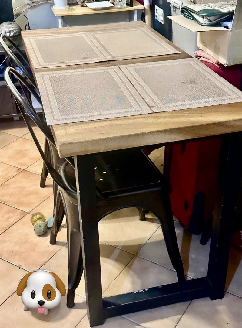 Rustic Dining Table with Metal Chairs (Category: Tables & Sets) located in Manila. Submitted by gboi1982 (Listing ID 1455385997, Image 2). Description: - Natural wood grain dining table (solid Acacia) - Includes 4 dark metal chairs with industrial design - Ideal for small dining areas or kitchens - Easy to clean and maintain - Versatile for daily use and entertaining.