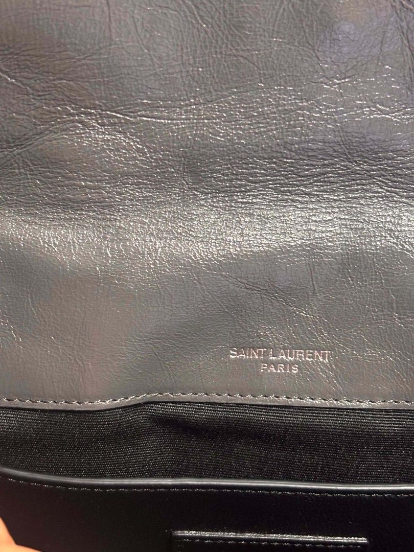 Saint Laurent Paris Grey Leather Shoulder Bag (Category: Luxury Bags & Wallets) located in Caloocan City. Submitted by nikititabacs (Listing ID 1455389650, Image 3). Description: - Authentic Saint Laurent Paris shoulder bag - Color: Grey - Material: Leather - Design: Quilted with chevron stitching - Closure: Magnetic snap - Strap: Chain strap - Interior: Zipped pocket.