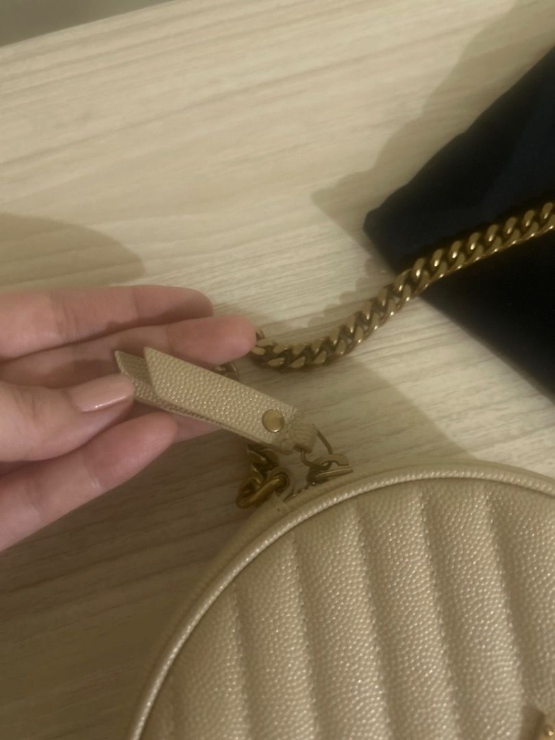 Saint Laurent Round Bag with Dust Bag (Category: Luxury Bags & Wallets) located in Cebu City. Submitted by serene_simplicity (Listing ID 1455321871, Image 2). Description: - “OG quality” Saint Laurent Round Bag - Color: Beige - Material: Quilted Leather - Features: Iconic YSL logo, Gold chain strap - Includes: Original dust bag - Perfect for: Going out, evenings, special occasions.