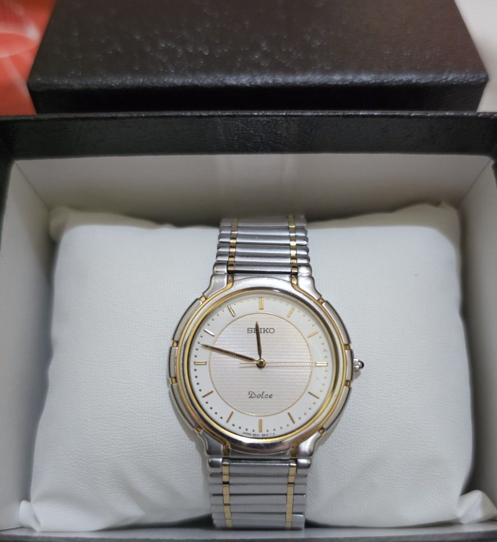 Seiko Dolce Two-Tone Watch (Category: Luxury Watches) located in Cavite. Submitted by kazi_preloved (Listing ID 1455350625, Image 1). Description: - Authentic Vintage Seiko Dolce watch - Two-tone stainless steel band with gold accents - Classic white dial with gold markers - Water resistant - wrist size 18-19cm - Comes with a box.