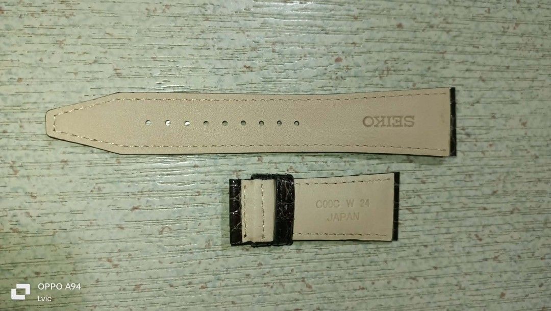 Seiko leather strap (Category: Luxury Watches) located in Quezon City. Submitted by Bernz (Listing ID 1455380189, Image 1). Description: Brand: SeikoPart Code: C00C W 24Lug Width: 24 mm (indicated by the "24" stamped on the underside)Origin: Made in JapanMaterial: Genuine leather lining with an alligator/crocodile style embossed dark exterior..