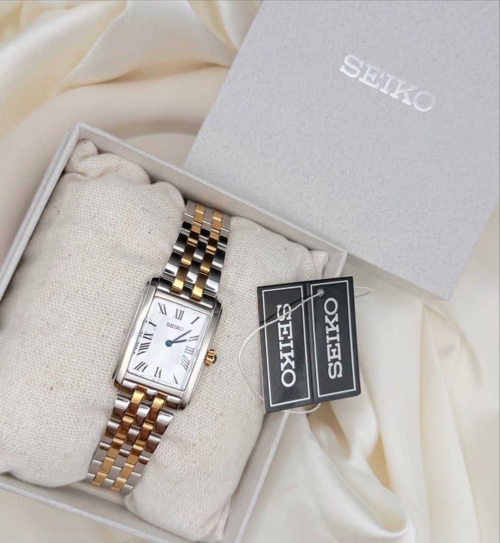 Seiko Two-Tone SWR087 (Category: Luxury Watches) located in Lipa City. Submitted by watchoutph (Listing ID 1455472904, Image 3). Description: Seiko Tank SWR087 Two-toned Blue hands and blue onyx crown Black roman indices Sunburst Dial Brand new condition Complete (outer box, gray box, pillow, tag, warranty card, microfiber cloth) ₱15,500.