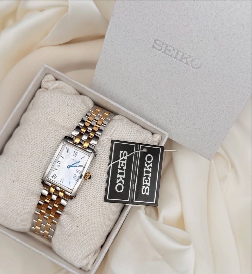 Seiko Two-Tone SWR087 (Category: Luxury Watches) located in Lipa City. Submitted by watchoutph (Listing ID 1455472904, Image 2). Description: Seiko Tank SWR087 Two-toned Blue hands and blue onyx crown Black roman indices Sunburst Dial Brand new condition Complete (outer box, gray box, pillow, tag, warranty card, microfiber cloth) ₱15,500.