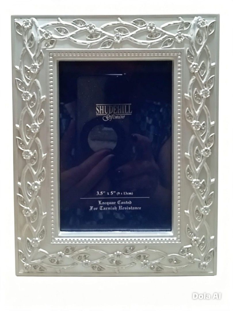 Shudehill Lacquer-Coated Picture Frame" (Category: Frames & Pictures) located in Paranaque City. Submitted by gentle.declutter (Listing ID 1455379170, Image 1). Description: - Size: Fits 3.5" × 5" (9×13cm) photos; elegant silver-toned finish - Features: Premium lacquer coating for tarnish resistance, intricate floral/vine openwork with subtle crystal accents, quality Shudehill Giftware brand - Condition: Brand new, unused, flawless — ready for di