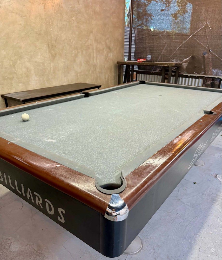 Star Billiards Maxima 7 Pool Table with Cues (Category: Billiards and Bowling) located in Manila. Submitted by miriamcfer28043 (Listing ID 1455407096, Image 1). Description: - Star Billiards Maxima 7 pool table - Includes billiard cues and balls - Grey felt playing surface - Dark brown wooden trim with minor scuffs - Ideal for game rooms or bars - Ready for pickup.